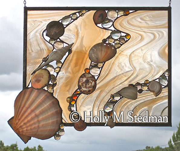 Stained glass panel with shells and tan highlights