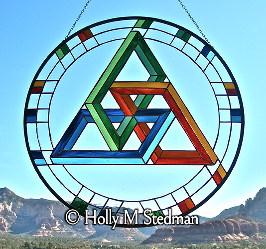 Circular stained glass panel with geometric design