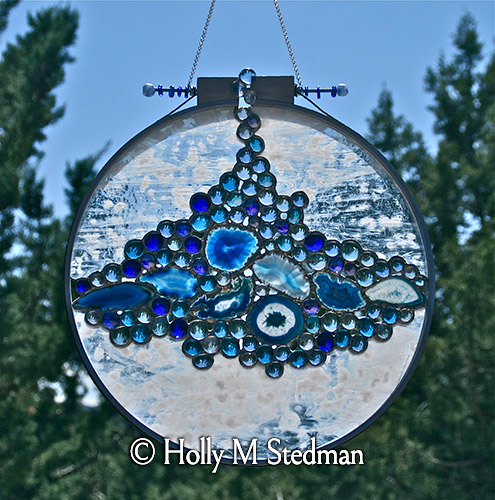 Circular stained glass panel with blue nuggets