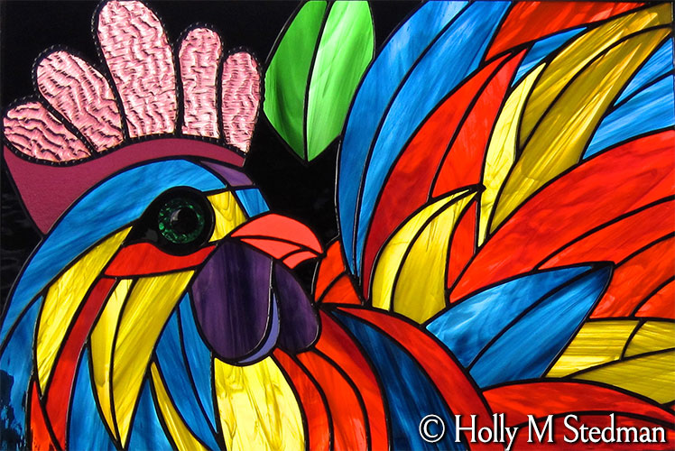 Colorful stained glass panel of a rooster
