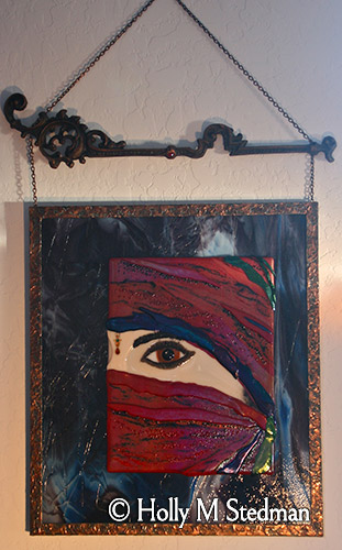 Framed fused glass panel of a woman