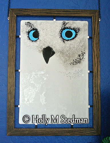 Framed fused glass panel of a white owl
