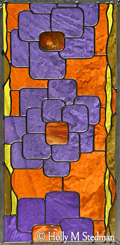 Stained glass panel with geometric flowers