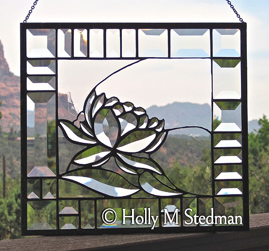 Stained glass panel with elegant bevelled flower design
