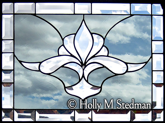 Stained glass panel with flowing bevel design