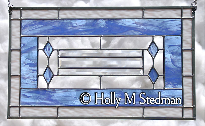 Stained glass panel with white and blue elements
