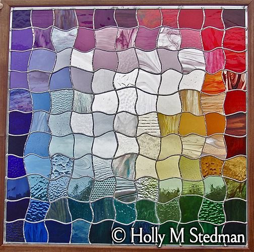 Patchwork stained glass panel with many colors