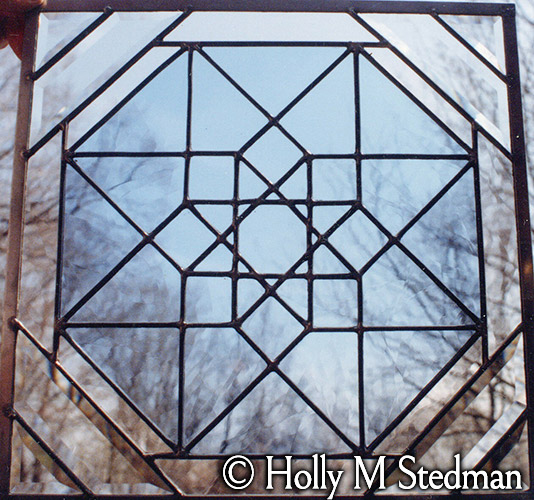 Stained glass panel with star pattern