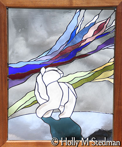 Framed stained glass panel of a polar bear and the nothern lights