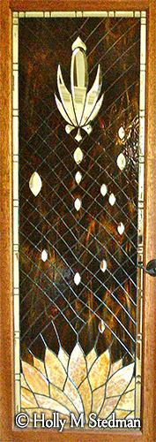 Stained glass door of a flowering century plant