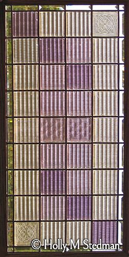 Stained glass window with textured white and purple squares