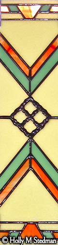 Three-piece stained glass window with white, orange and turquoise geometric design, panel 3